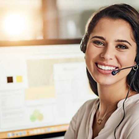 Cropped shot of an attractive young businesswoman wearing a headset and sitting alone in her office